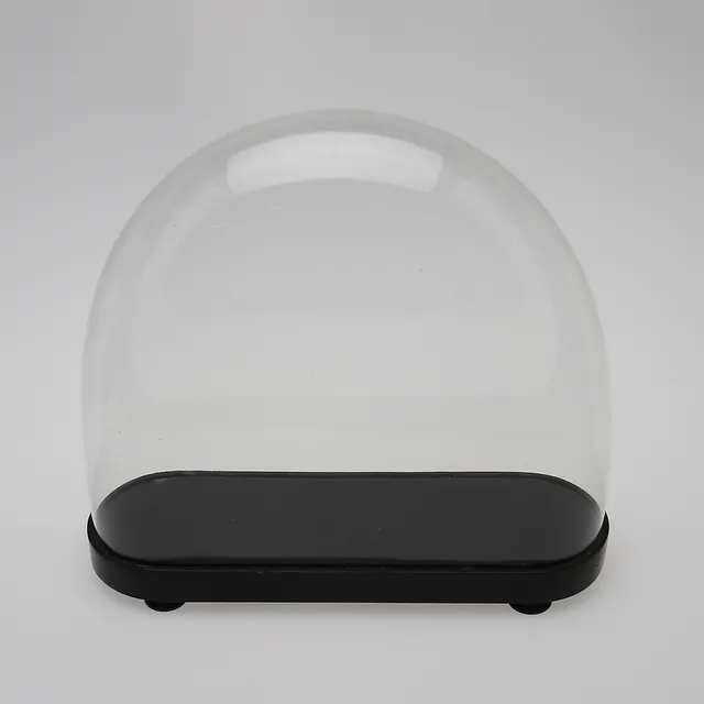A 20TH CENTURY MOULDED GLASS DOME.