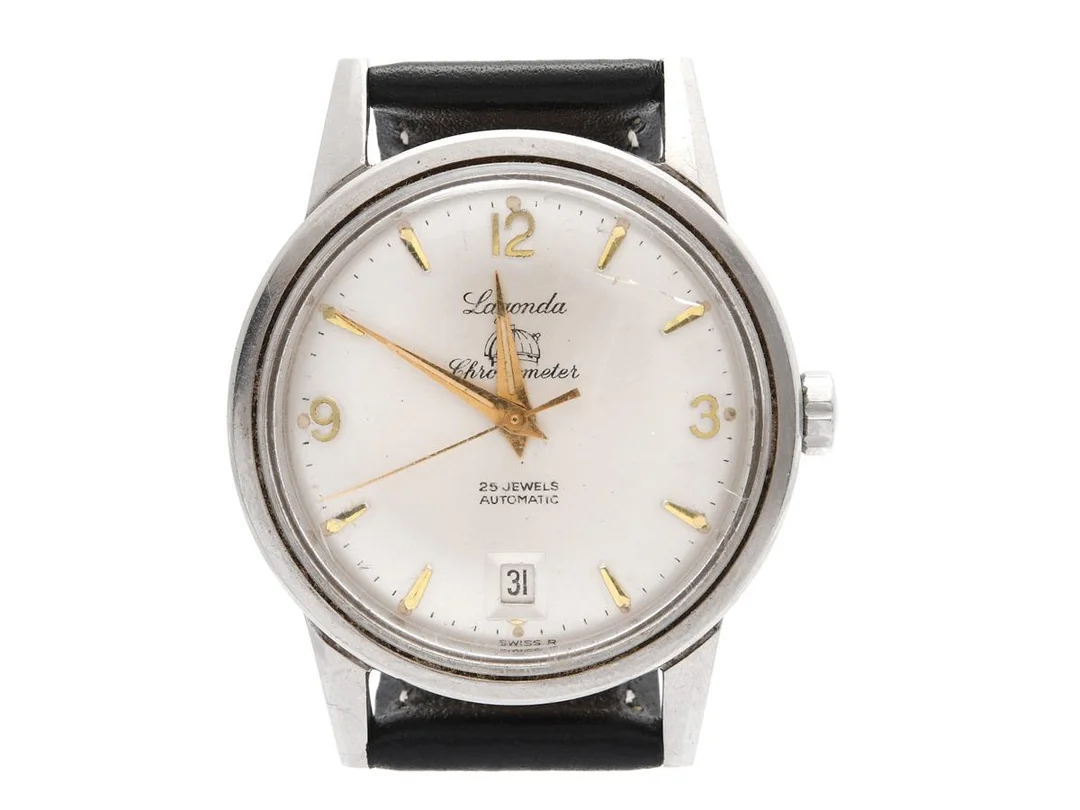 LAGONDA, Chronometer, herrur, 35 mm, Cal ETA 2472, Verk nr. 2017, stål, automatisk, plexiglas (skadat), datum, skadad urtavla, läderband, ca 1965. — Klockor/Lagonda — Kaplans