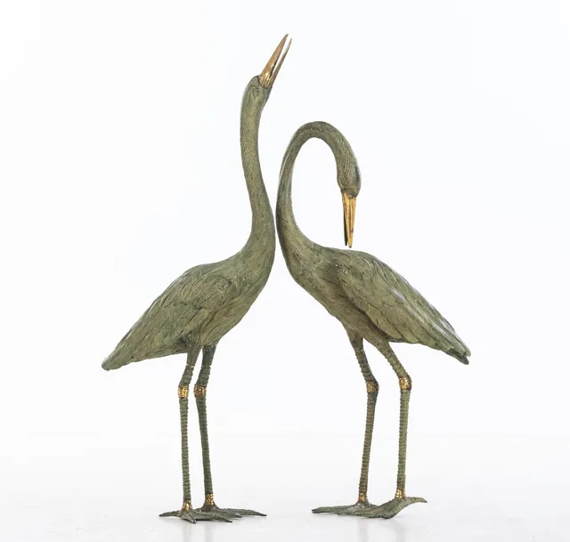 Two cranes of patinated bronze (2)