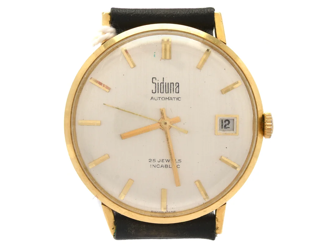 Siduna automat, 18K, herrur, 34mm, datum, plastglas, bucklor på boetten, med svart läderarmband — Klockor/Siduna — Kaplans