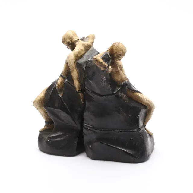 KAI NIELSEN. EFTER. Bokstöd, ett par, patinerad konstmassa.