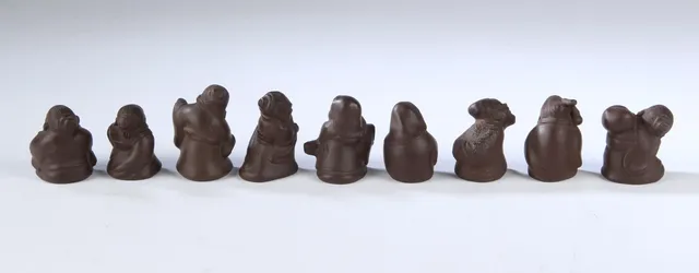 A collection of small Chinese figurines made of Yixing stoneware (9)