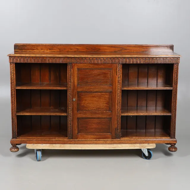 LARGE CARVED OAK BOOKCASE - WARING & GILLOW.
