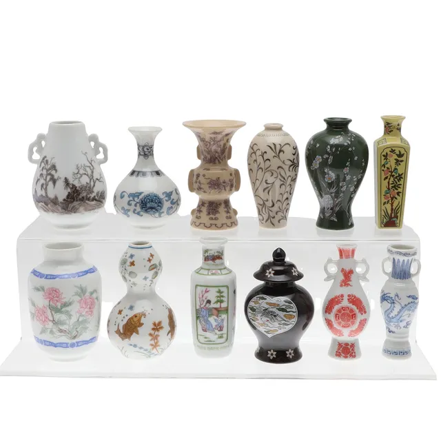 FRANKLIN MINT. A COLLECTION OF TWELVE COLLECTOR'S VASES IN THE ORIENTAL STYLE.