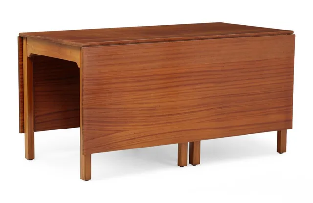 Table of solid mahogany, top with two leaves. Manufactured and marked by Rud. Rasmussen snedkerier. H. 75. L. 71/186. W. 146 cm.