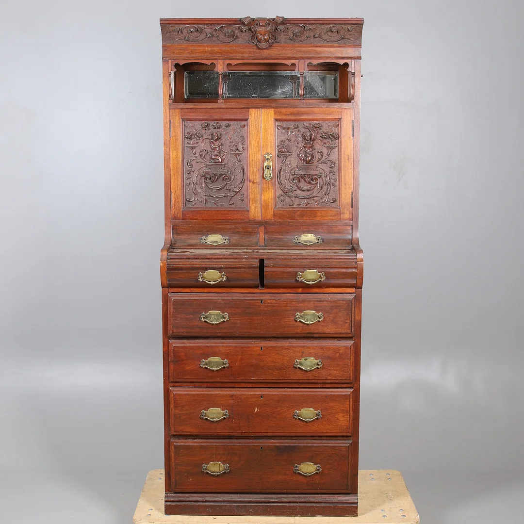 A EARLY 20TH CENTURY NORTH EUROPEAN CARVED WALNUT AND PINE CUPBOARD CHEST. — Cupboards, Cabinets & Shelves — Lawrences Auctioneers
