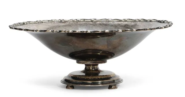 Oval silver bowl, upper rim with relief decoration. Circular base with four feet. Manufactured and stamped by Kay Bojesen. Weight 268 g. H. c. 7 cm. W. 13.5 cm. L. 18.6 cm.