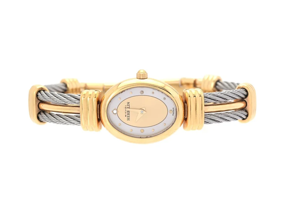 MICHEL HERBELIN, Paris, Boett nr. 7023.B, damur, 18 x 23 mm, bicolour, quartz, mineralglas, defekt, integrerad originallänk, längd 165 mm, cert, mars 2000, box (ej komplett). — Klockor/Michel Herbelin — Kaplans