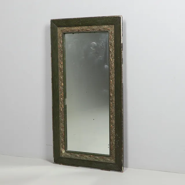 AN ART NOUVEAU MIRROR.