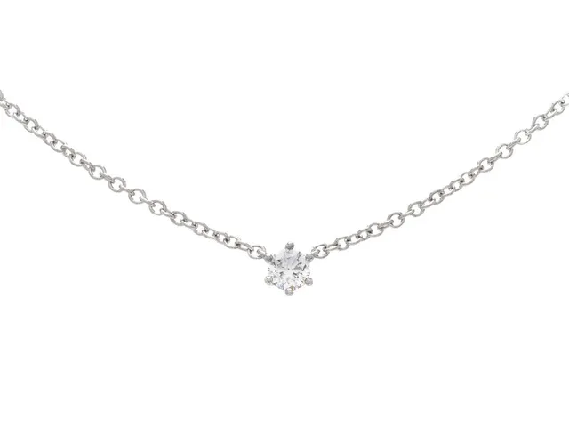 ENSTENSCOLLIER, 18K vitguld, briljantslipad diamant ca 0,08 ct, ca W/VS, längd 42/45 cm, vikt 1,8 g.
