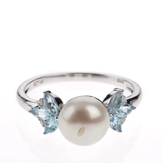 Diamonds By Frisenholm. Ring of 9 kt. white gold with topaz, freshwater pearl and brilliants. Size 55