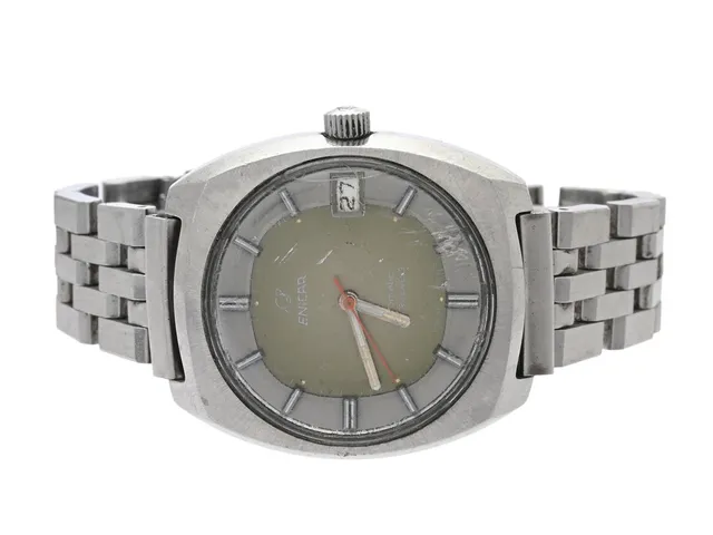ENICAR, Star Jewels (T Swiss Made T), Boett nr. 165-54-07, herrur, 35 mm, stål, automatisk, plexiglas (skadat), datum, defekt (servicebehov), skadad urtavla, ca 1970, metallänk ej original.