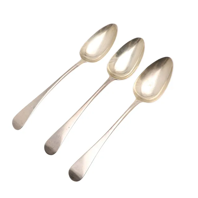 THREE GEORGE III SILVER SERVING SPOONS.
