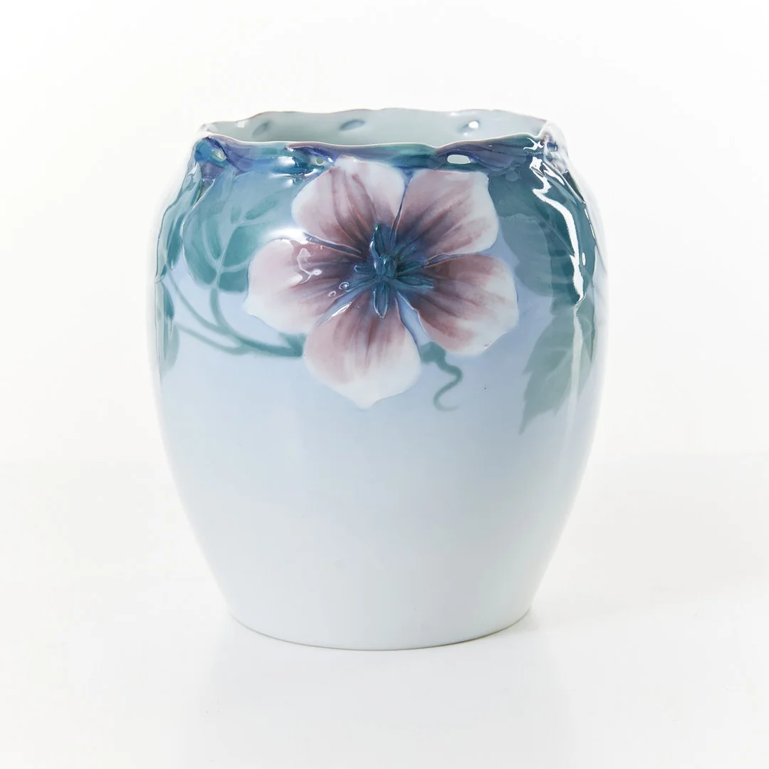 ASTRID EWERLÖF. vas, Rörstrand, porslin, jugend, blåtonad, dekor av polykrom dekor i relief av blommor, genombruten överdel, märkt E Rörstrand , inpressad märkning A 2473 RR. — European — Stockholms Auktionsverk Magasin 5