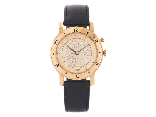 TISSOT, Navigator (Swiss Made), World Time, Cal 28,5 N-21, Serie nr. 2591699, Boett nr. 3029589, herrur, 36 mm, 14K guld, hammarautomat, plexiglas, 24-timmarsvisning, världstider, läderband, ca 1953.