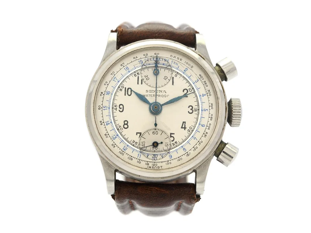 SIDUNA, Waterproof, "Baby Chronograph", Cal Venus 170, Boett nr. 253668 / 1771 / 771, kronograf, herrur, 32,5 mm, stål, manuell, plexiglas (skadat), skadad urtavla, läderband, ca 1950. — Klockor/Siduna — Kaplans