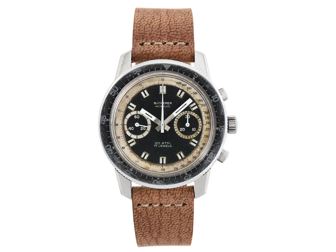 BUCHERER, "Incabloc" (T Swiss Made T, 20 ATM), kronograf, herrur, 40,5 mm, Cal Valjoux 7733, Boett nr. 6886 / 1382, stål, manuell, plexiglas, boett signerad "Charles Gigandet", läderband, ca 1970. — Klockor/Bucherer — Kaplans