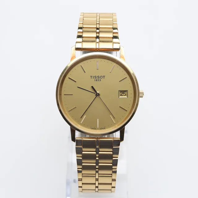 HERRUR Tissot 18K guld quartz.
