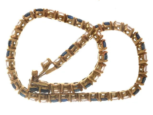 Tennisarmband 18K 10,4g 18cm med blå stenar och diamanter 26xca0,07ct