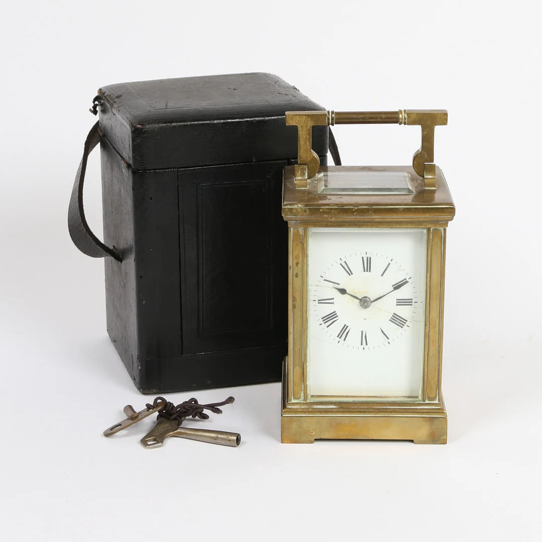 A FRENCH BRASS CARRIAGE CLOCK IN FITTED TRAVEL CASE. — Carriage & Miniature Clocks — Bishop & Miller