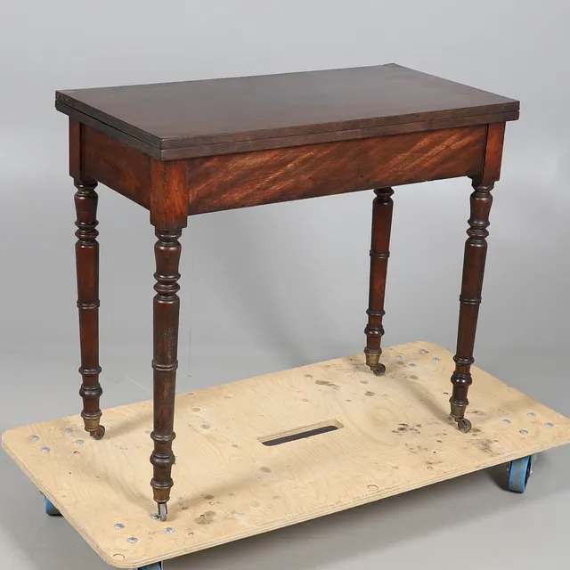 A MAHOGANY CARD TABLE.