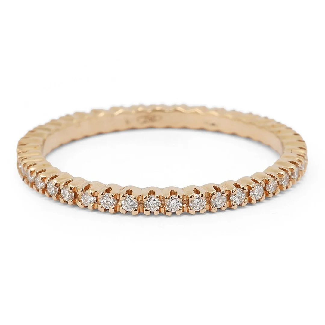 A diamond eternity ring set with numerous brilliant-cut diamonds weighing a total of app. 0.25 ct, mounted in 18k rose gold. Weight app. 1.5 g. Size 51.5. — Jewellery/Rings — Bruun Rasmussen