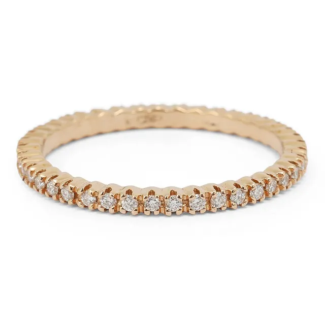 A diamond eternity ring set with numerous brilliant-cut diamonds weighing a total of app. 0.25 ct, mounted in 18k rose gold. Weight app. 1.5 g. Size 51.5.