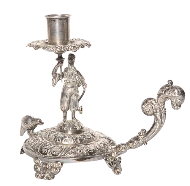 UNA PALMATORIA EN PLATA REPUJADA. A.J. CARRERAS.