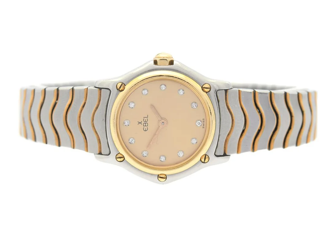 EBEL, Classic Wave, Mini, Cal 057, Serie nr. 11658203, Boett nr. 1057901, damur, 24,5 mm, stål/guld, quartz, safirglas (repa), diamanturtavla (12 st. 8/8), skadad urtavla/visare, integrerad originallänk, viklås, Ref nr. 0988, ca 1988. — Klockor/Ebel — Kaplans