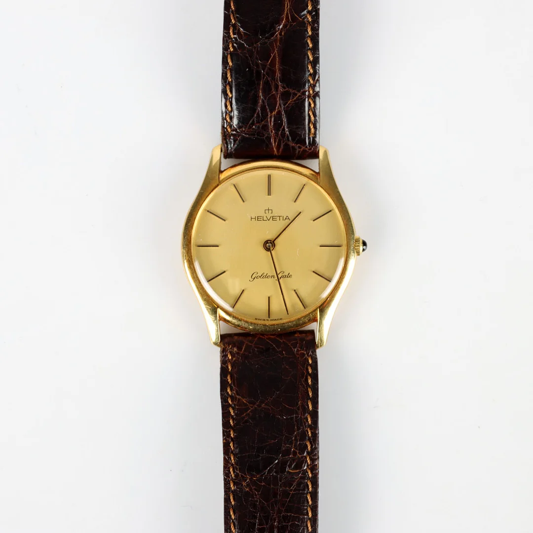 ARMBANDSUR HELVETIA GOLDEN GATE, 18K guld, manuell, 1900-talets mitt. — Wristwatches — Auktionsverket Engelholm