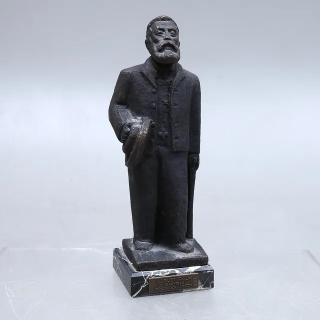 TURE JOHANSSON. "August Palm", skulptur, brons, stensockel, signerad, 1900-tal.