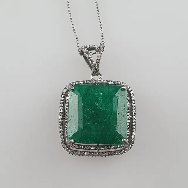 - 48.40cts Emerald Gemstone Pendant with two rows of diamonds.