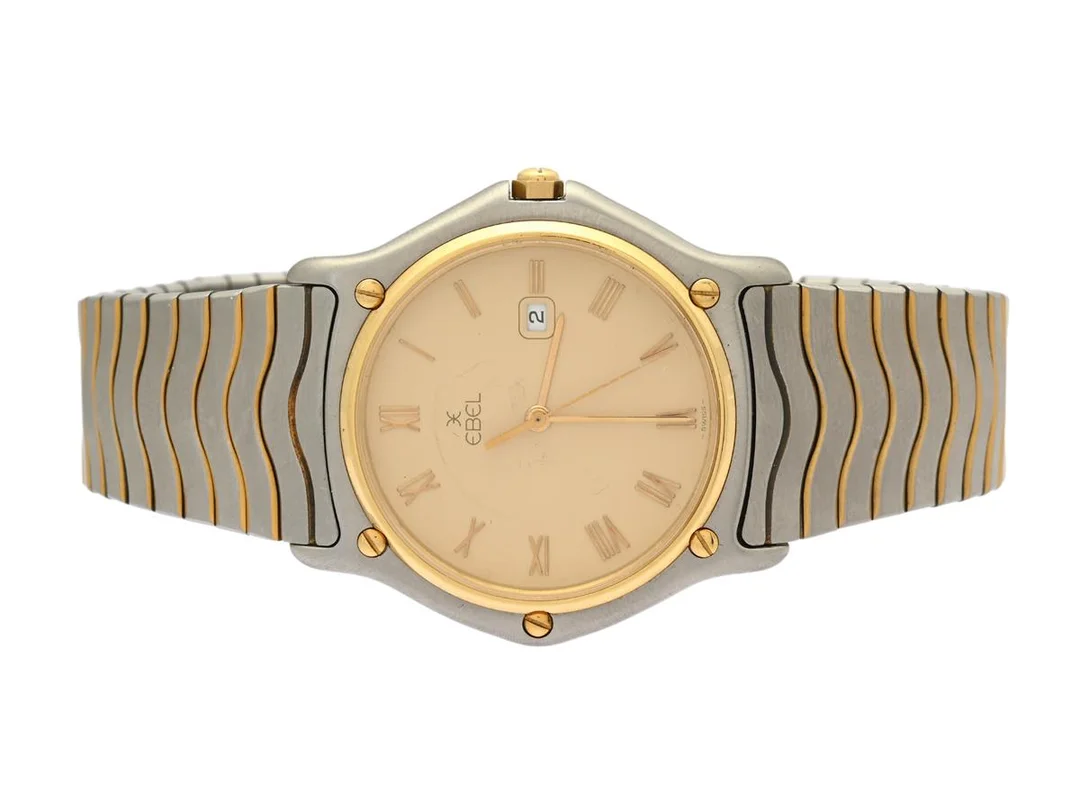 EBEL, Sport Classic, Senior, Serie nr. 14625691, Boett nr. 183903, herrur, 34 mm, stål/guld, quartz, safirglas, datum, skadad urtavla, integrerad originallänk (bicolour), viklås, Ref nr. 0888, ca 1988. — Klockor/Ebel — Kaplans