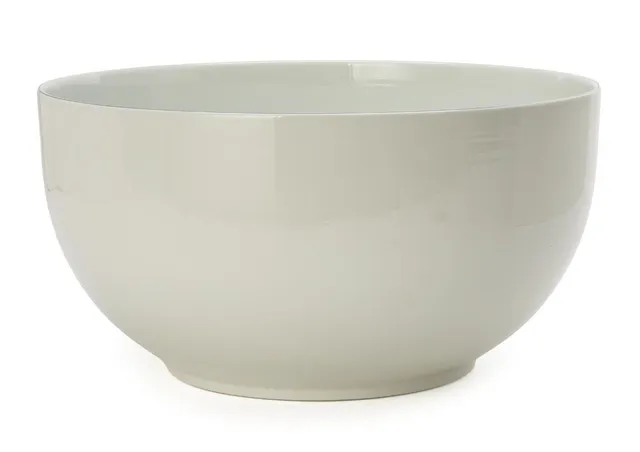 “Blåkant”. A large fainence bowl decorated with transparent glaze. The upper rim with blue glaze. Made and marked by Royal Copenhagen, 3084. H. 21.5 cm. Diam. 42 cm.