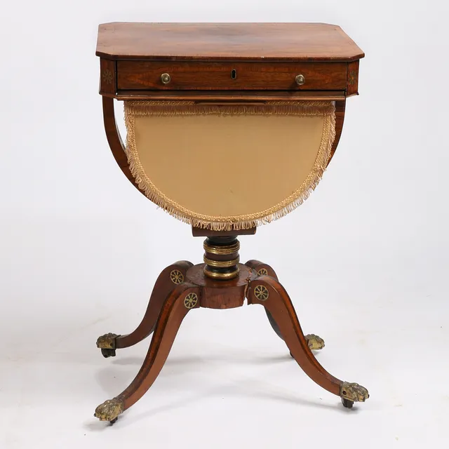 A REGENCY ROSEWOOD SEWING TABLE.