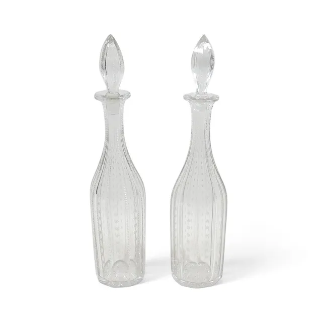 A PAIR OF 19TH CENTURY CUT GLASS DECANTERS.