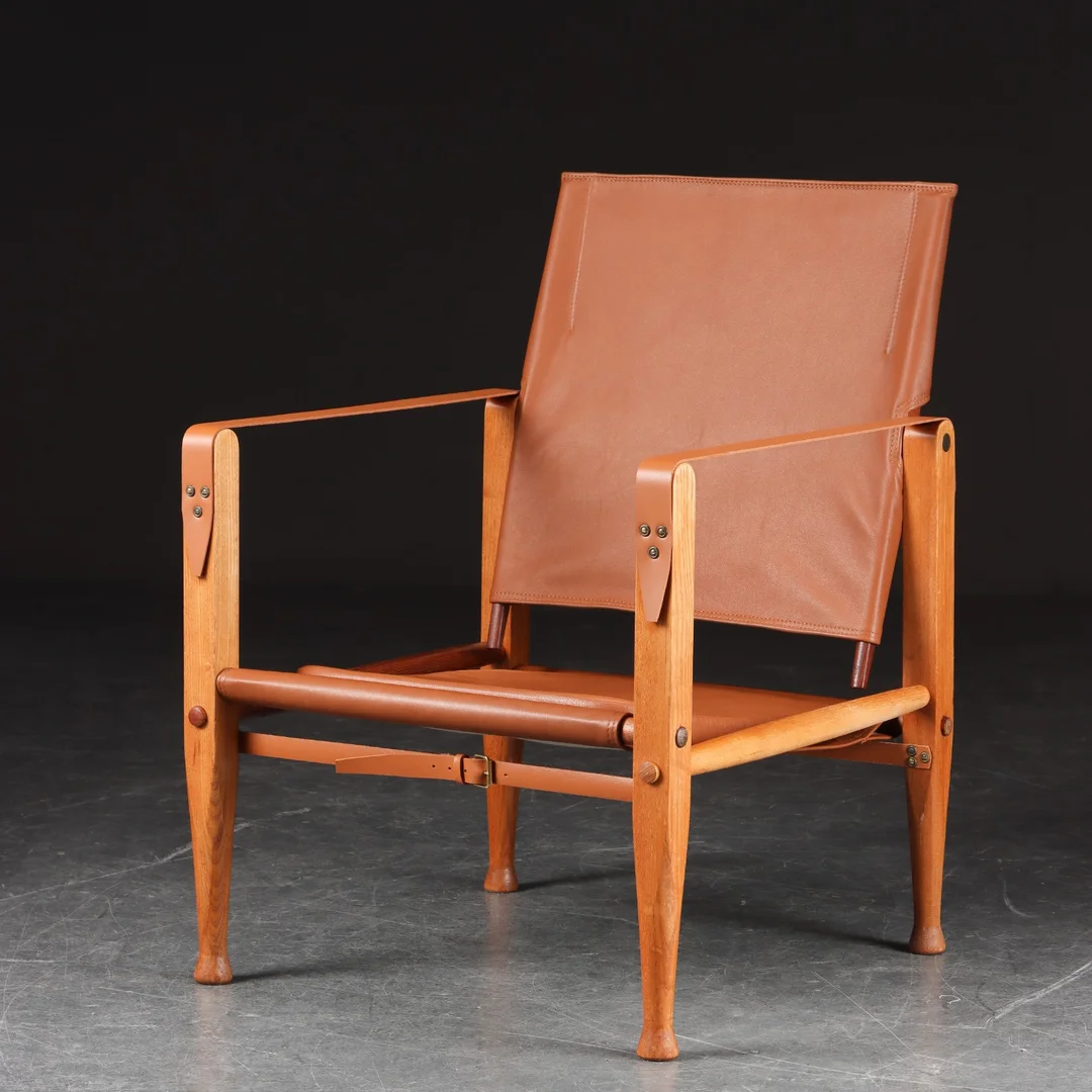 Kaare Klint. Safari chair upholstered in cognac colored aniline leather — Furniture/Lounge chairs — Lauritz
