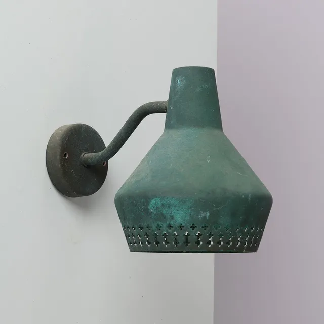 ATTRIBUTED TO HANS BERGSTRÖM (1910-96). Outdoor wall lamp in verdigris copper with perforated shade, presumably manufactured by Ateljé Lyktan, Sweden, 1950s.