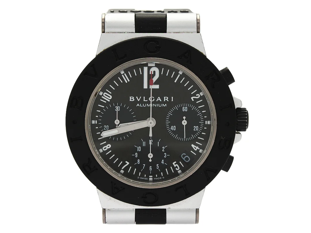 BVLGARI, Aluminium, Cal 080 TEEE, Verk nr. 133738, Serie nr. L 22973, Ref nr. AC 38 TA, kronograf, herrur, 38 mm, aluminium, automatisk, safirglas, datum, defekt, integrerat gummiband, originalspänne, ca 2000. — Klockor/Bvlgari — Kaplans