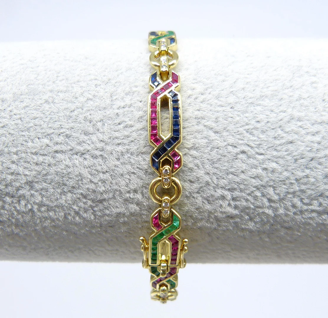 18CT YELLOW GOLD DIAMOND, SAPPHIRE, EMERALD AND RUBY BRACELET. — Bracelets — Rumsey’s Auctioneers