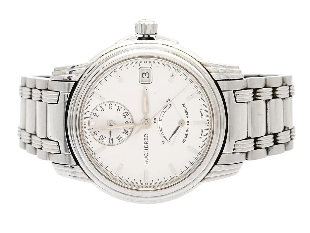 BUCHERER, Archimedes, Cal ETA 2892A2, Boett nr. 9035-507, herrur, 36 mm, stål, automatisk, safirglas (nagg), datum, 24-timmarsvisning, gångreservsindikator, skadad urtavla, defekt (akut servicebehov), skadad krona/kronhals, originallänk, viklås, längd 170 mm, ca 2000. — Klockor/Bucherer — Kaplans
