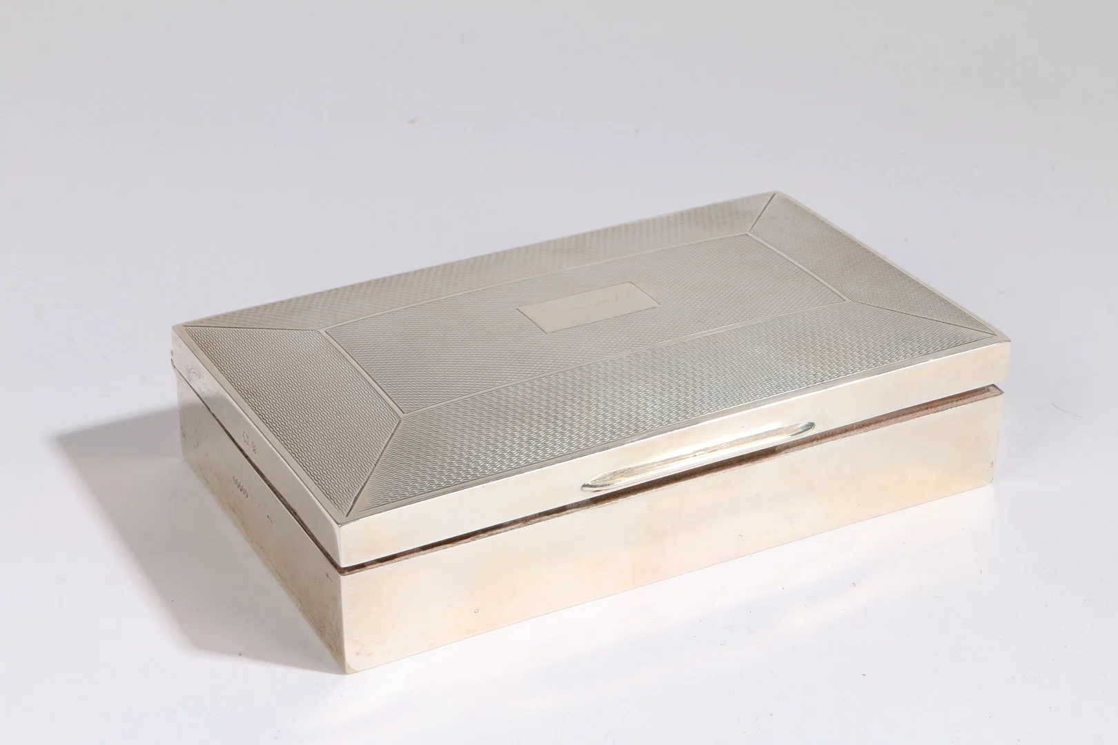 A LATE GEORGE VI SILVER CIGARETTE CASE. — Silver — Bishop & Miller