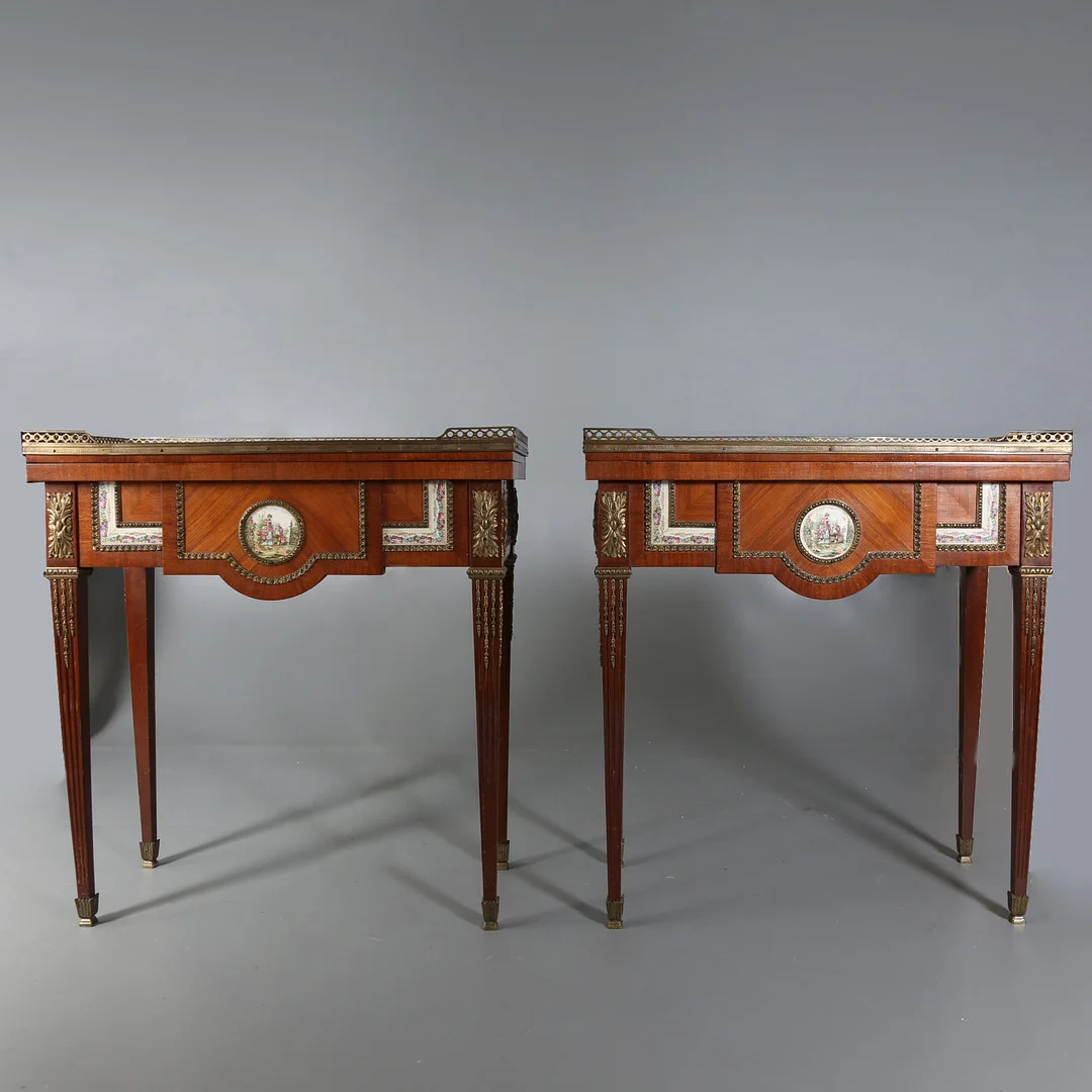 Pair of Louis XVI style game tables in mahogany and rosewood marquetry, with porcelain and bronze applications, circa 1930. — Tables — Balclis