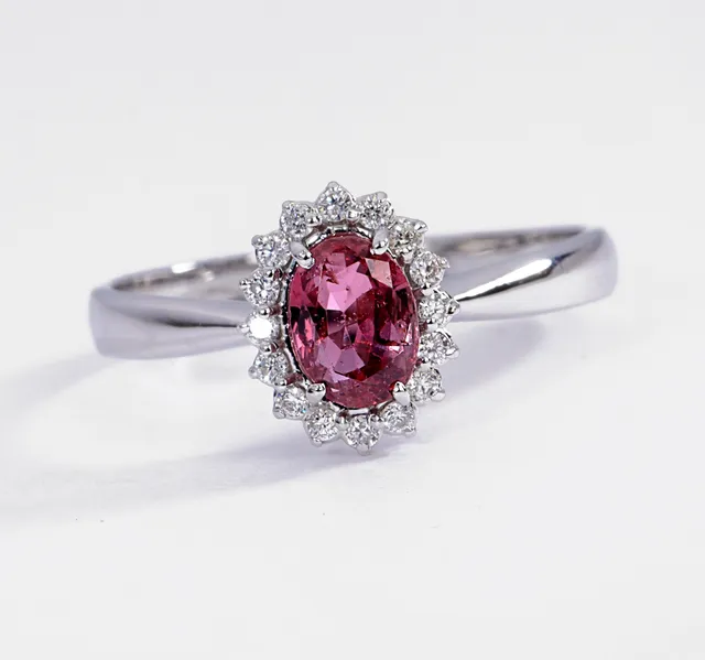 Ruby and diamond rosette ring in 18 kt. white gold