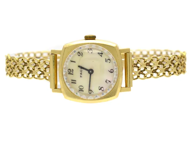 Damur Facit 18K manuell med armabnd X-länk 18K 18cm Brv 21,3g