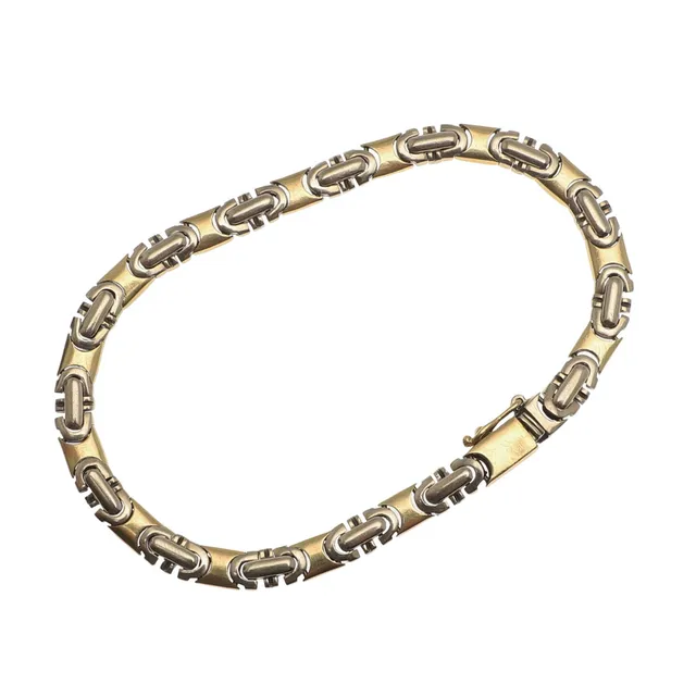 AN 18CT TWO COLOUR GOLD BRACELET.