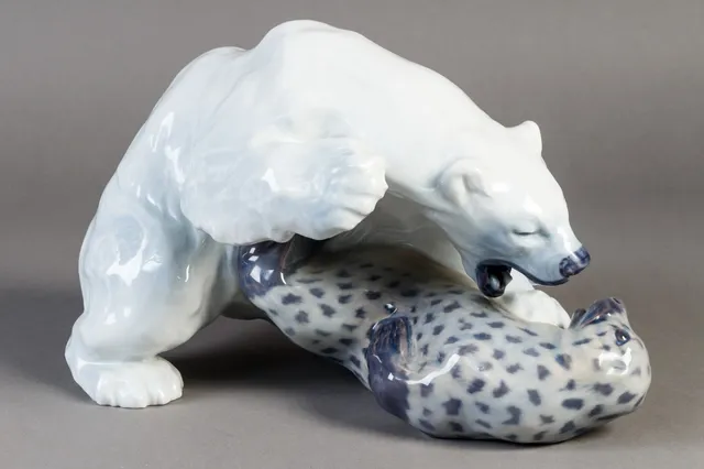 Knud Kyhn for Royal Copenhagen. Porcelain figure. Polar bear attacking a seal,