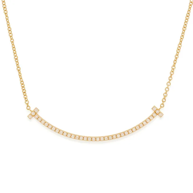 TIFFANY & CO. Tiffany T collection, 'T Smile small ' halskæde af 18 kt guld med diamanter. 0,10 ct.