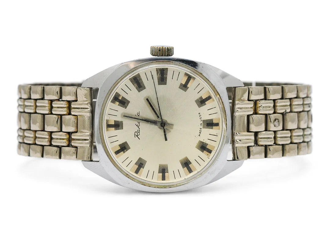 RAKETA, herrur, 33 mm, vitmetall, manuell, plexiglas, skadad urtavla, ca 1975, metallänk ej original. — Klockor/Övriga klockor — Kaplans