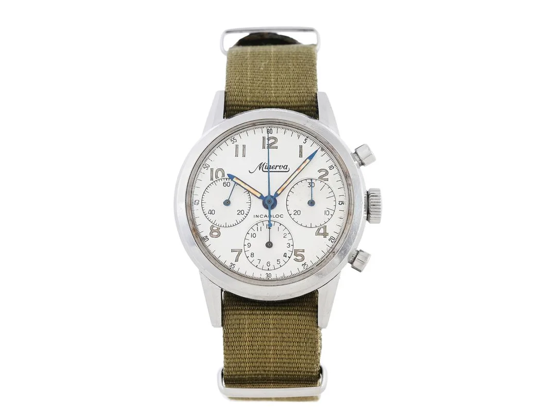 MINERVA, "Incabloc" (T Swiss T), Cal Valjoux 726, Ref nr. VD 712, Boett nr. 333380, kronograf, herrur, 37 mm, stål, manuell, plexiglas, böjt bandhorn, NATO-band, ca 1970. — Klockor/Minerva — Kaplans